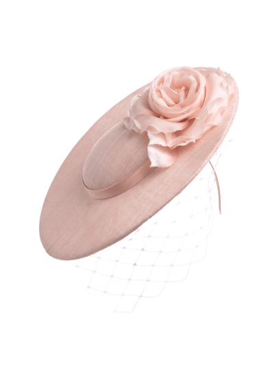 Pale pink disc hat with flower and veil