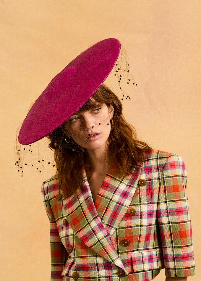 wide-brimmed pink hat with veil