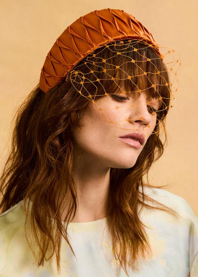 orange headpiece in silk with a veil